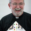 standrew-milford > Father Rob Waller smiles with his pope hat  with the students at the Seton campus of St. Andrew-St. Elizabeth Ann Seton School in Milford  celebrated the Pope Benedict's visit to the US and his 81st birthday . (Photo by Tony Tribble)